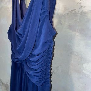 Royal blue evening gown with scalloped back.